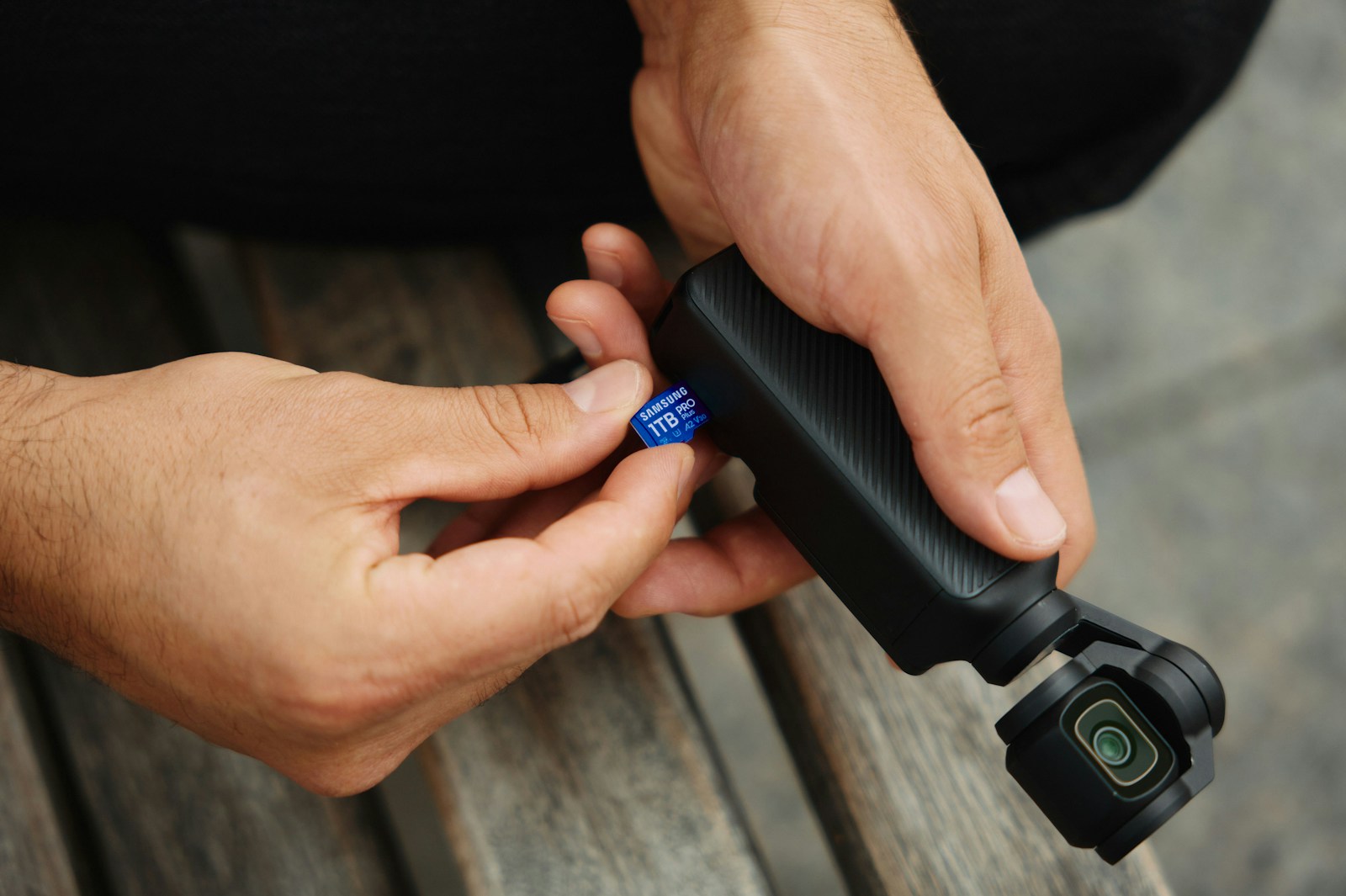 A person holding a camera in their hands